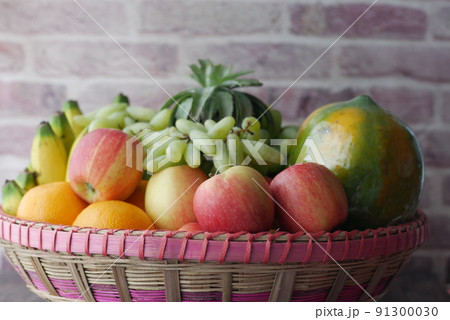 top view of mixed fruits in a bowl on table  91300030
