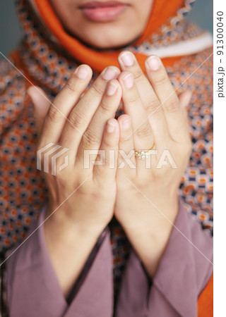 Close up of muslim women hand praying at ramadan  91300040