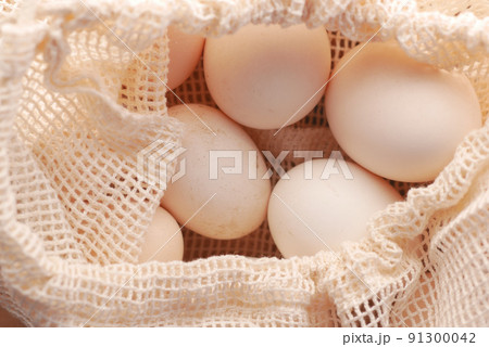 close up of eggs in a shopping bag table  91300042