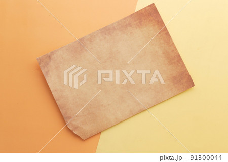 old vintage paper on color background close up  91300044