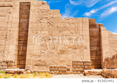 Ancient carvings on the wall of the Karnak Temple, 7 pylon view, Luxor, Egypt 91301441