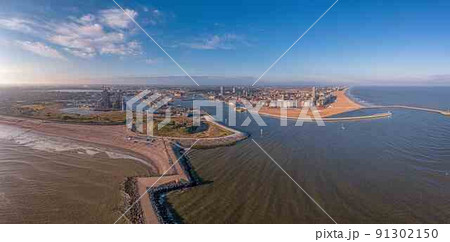 Drone panorama over the harbor and skyline of the city of Oostende 91302150