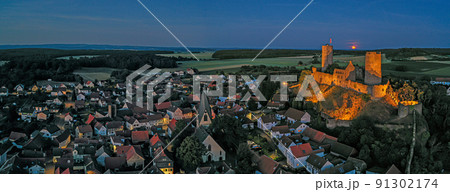 Image of illuminated Muenzenberg castle ruin in Germany in the evening Image of illuminated Muenzenberg castle ruin in Germany in the evening 91302174