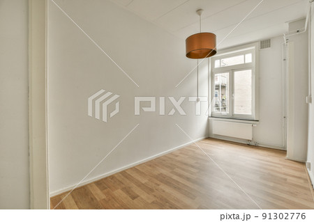 Plastic window and radiator on white wall in empty light room at home Plastic window and radiator on white wall in empty light room at home 91302776