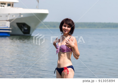 Rest of a European tourist on the seashore Rest of a European tourist on the seashore 91305894