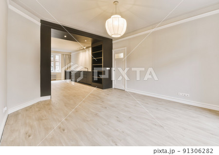Interior of empty white kitchen with windows and wooden parquet floor Interior of empty white kitchen with windows and wooden parquet floor 91306282