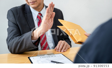 Businessman is refuses don't receive to accept banknote money and terms of contract from corruption bribe employer in signing agreement deal Businessman is refuses don't receive to accept banknote money and terms of contract from corruption bribe employer in signing agreement deal 91306553