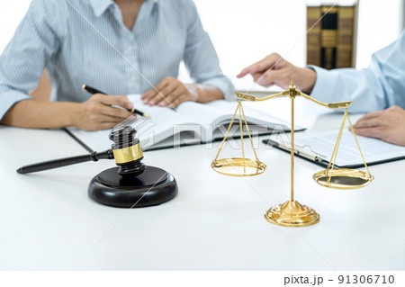 Businesswoman and Male lawyer or judge consult and conference having team meeting with client at law firm in office, Law and Legal services concept 91306710