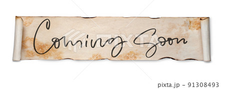 Coming soon. Handwritten inscription on a scroll of old paper. Isolated on white Coming soon. Handwritten inscription on a scroll of old paper. Isolated on white 91308493