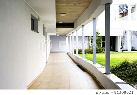 outdoor empty corridor with garden in the modern office building 91309021