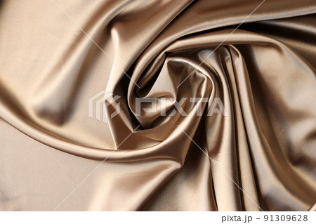 Beige satin fabric background. Texture of viscose is brown background Beige satin fabric background. Texture of viscose is brown background 91309628