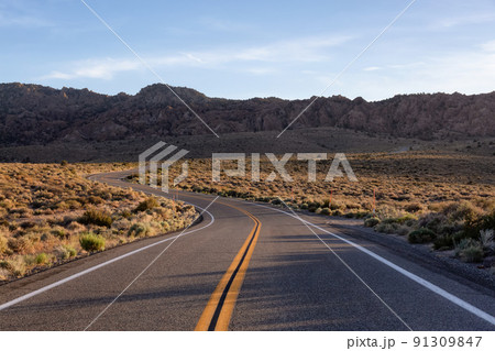 Scenic highway in the mountain landscape. Sunset Sky. Scenic highway in the mountain landscape. Sunset Sky. 91309847