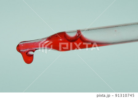 Close-up of a pipette with blood. The concept of developing pharmaceutical drugs for the treatment of diseases with the help of drugs that improve DNA. High quality photo 91310745