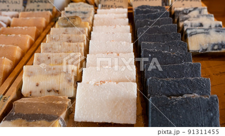 Columns and rows of various colorful homemade bar soaps Columns and rows of various colorful homemade bar soaps 91311455
