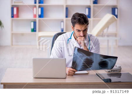 Young male doctor radiologist working in the clinic Young male doctor radiologist working in the clinic 91317149