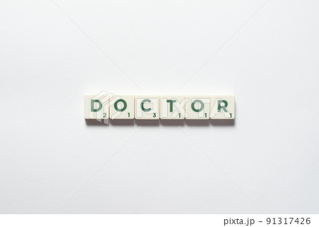 Doctor formed of scrabble blocks. 91317426