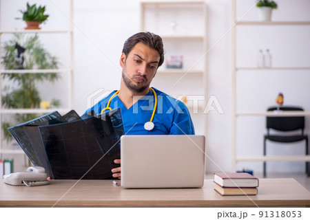 Young male doctor radiologist working in the clinic Young male doctor radiologist working in the clinic 91318053
