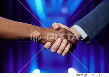 Recruiter Shaking Hands with Employee 91321300