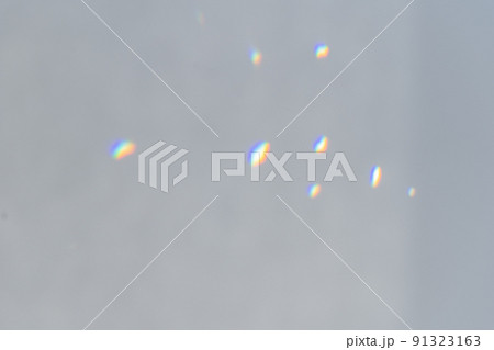 .Rainbow holographic shadow mock up, iridescent prismatic wallpaper. Abstract prism reflection, rays leaking through lens effect. Crystal light reflections for overlay mockup on light. 91323163