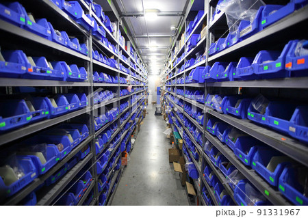 Industrial warehouse. Warehouse of a trade organization. Goods and materials arranged on a rack in warehouse. Warehouse store stock. Industrial warehouse. Warehouse of a trade organization. Goods and materials arranged on a rack in warehouse. Warehouse store stock. 91331967