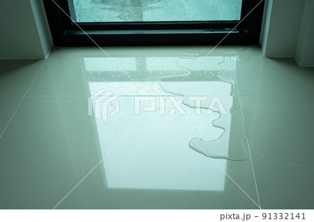 Water leaking on tile floor. Water leaks are often because of pinholes in your plumbing system or small failures in caulking or other exterior materials. Water leaking on tile floor. Water leaks are often because of pinholes in your plumbing system or small failures in caulking or other exterior materials. 91332141