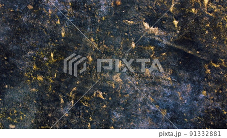 Aerial drone view flight over black ash of field of burned brown yellow dry grass and white smoke on sunny autumn day. View from above. Texture natural background of ecological environmental disaster. 91332881