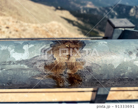metal texture. observation deck with railings. the fence is painted gray and already corroded with age. broken metal pipe 91333691