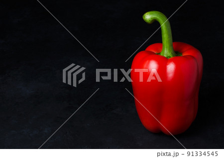 Red pepper on a black background. Paprika. The species capsicum annuum. Copy space Red pepper on a black background. Paprika. The species capsicum annuum. Copy space 91334545