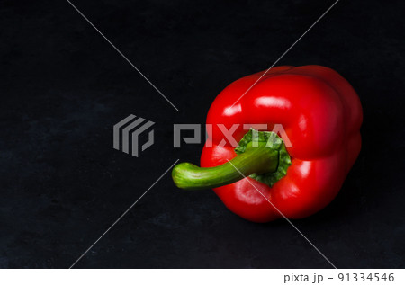 Red pepper on a black background. Paprika. The species capsicum annuum. Copy space 91334546