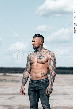 Sexy portrait of muscular handsome topless male model at the beach 91343290