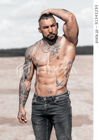 Sexy portrait of muscular handsome topless male model at the beach 91343293