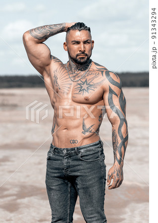 Sexy portrait of muscular handsome topless male model at the beach 91343294