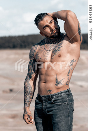 Sexy portrait of muscular handsome topless male model at the beach 91343863