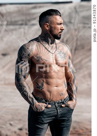 Sexy portrait of muscular handsome topless male model at the beach 91343870