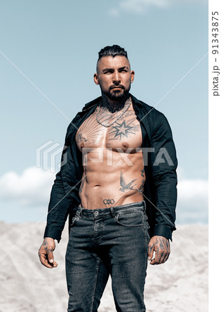 Sexy portrait of muscular handsome topless male model at the beach Sexy portrait of muscular handsome topless male model at the beach 91343875
