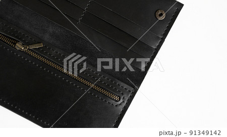 Top view on open men's black empty leather wallet with a zip and lots of pocket. Leather accessories. 91349142