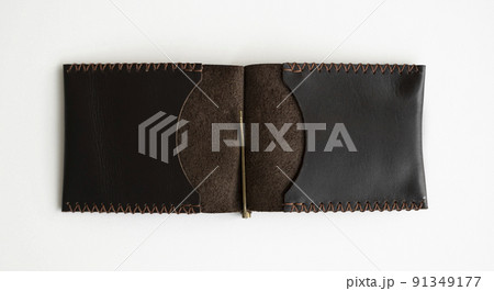 Men's business genuine leather money clip on a white surface. Accessories. 91349177