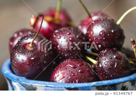 Fresh cherry berries in drops of water 91349767