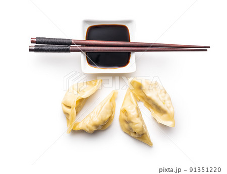 Chinese dumplings and soy sauce isolated on white background. 91351220