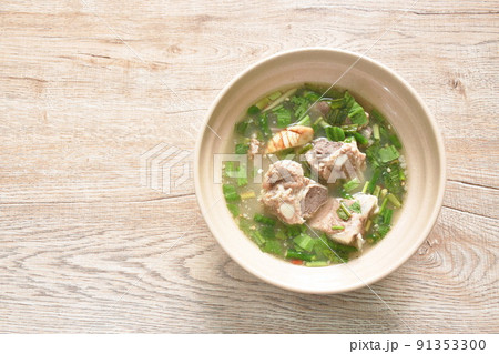 hot and spicy pork bone with tamarind and Thai herbs soup on bowl  91353300