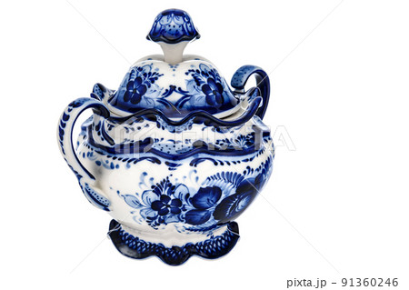 Tableware Empty Sugar Bowl Casket Figurine Sculpture Porcelain Ceramic Isolated on white background. Cobalt Blue color is traditional folk floral painting. Decor for interior of premises. Tableware Empty Sugar Bowl Casket Figurine Sculpture Porcelain Ceramic Isolated on white background. Cobalt Blue color is traditional folk floral painting. Decor for interior of premises. 91360246