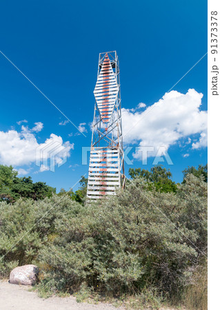 Watch tower in the forest on blue sky. Watch tower in the forest on blue sky. 91373378
