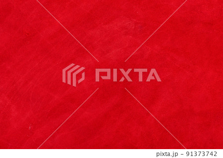 Red suede genuine leather background. Velvet red background close-up photo. 91373742