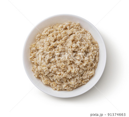 Bowl of oatmeal isolated on white background, top view 91374663