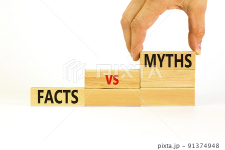 Facts vs myths symbol. Concept words Facts vs myths on wooden blocks on a beautiful white table white background. Businessman hand. Business, finacial and facts vs myths concept. Copy space. 91374948