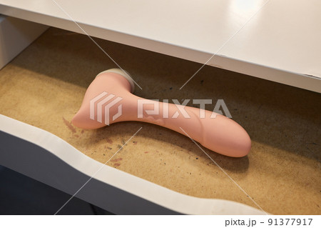 Different sex toys in open chest of drawers. Different sex toys in open chest of drawers. 91377917
