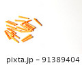 Plastic orange dowels on the white background. Construction and building background. 91389404