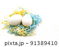 Minimal easter concept. Easter eggs in a colorful basket on a white background. Copy space for text. 91389410
