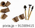 Gardening at home. Growing food on windowsill. Tools, peat pots for seedlings, seeds. top view. Flatlay on white background 91389415
