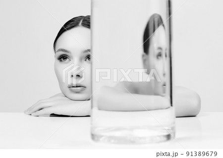pretty young woman in glass. Beauty Black and white Portrait 91389679